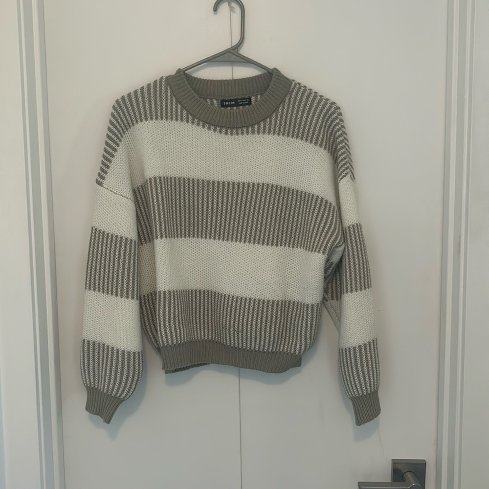 Green and white striped sweater